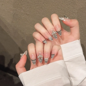 Handmade stiletto press-on nails with grey crocodile pattern, silver cross and pearls