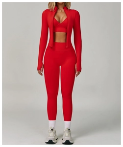 Detailed close-up of a high-elastic red three-piece yoga set with a slim-fit design