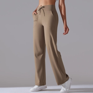 Detailed close-up of high-waisted wide-leg yoga pants with adjustable drawstring and pockets