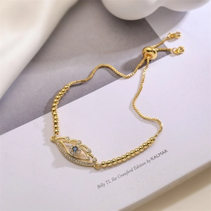 Detail of 18K gold evil eye bracelet with blue zircon and adjustable box chain