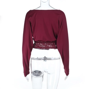 Detail view of burgundy long sleeve top with lace patchwork and waist cinching at back