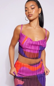 Detail of abstract geometric print and vertical pleated texture on two-piece set