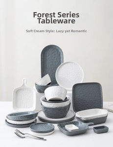 Detail of French style ceramic dinnerware set with irregular handmade ripple texture