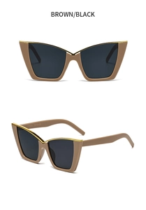 Detail view of cat eye sunglasses featuring brown frames with gold metal accents