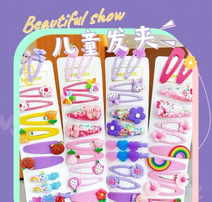 Close-up of candy-colored children hair clips with 3D resin animal and flower designs