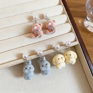 Cute flocked animal earrings with pearls featuring plush bears and bunnies in jewelry box