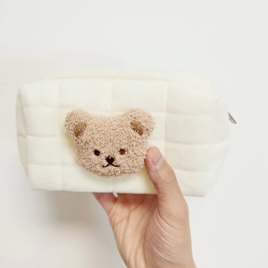 Plush embroidered bear makeup bag with quilted checkered pattern in off-white fabric