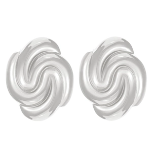 Detail of silver spiral stud earrings with mirror finish on minimalist background