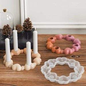 DIY heart ring silicone mold for candles and plaster crafts on wooden background