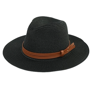 Detail of black woven straw Fedora hat featuring a dark brown leather band and studs