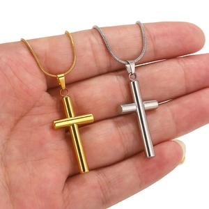 Gold and silver cylinder cross necklaces with snake chains on hand, stainless steel