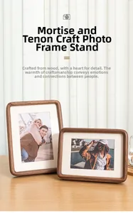 Detail of walnut wood photo frame showing traditional mortise and tenon joinery craft