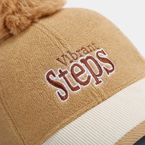 Brown wool baseball cap with Vibrant Steps embroidery and fuzzy pom-pom for kids