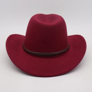 Detail view of deep red wool cowboy hat with brown braided trim and textured felt finish