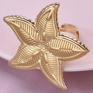 Macro shot of 304 stainless steel adjustable gold starfish ring with textured details