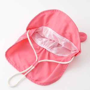 Detail view of pink baby sun hat showing breathable white mesh lining and adjustable chin strap