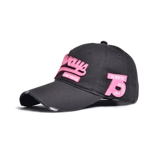 Detail of distressed baseball cap featuring pink 3D embroidery and side number patch