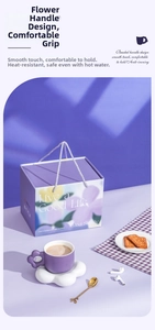 Detail of ceramic coffee set with purple flower handle mug and cloud coaster in a gift box