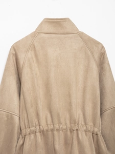 Detail of waist elastic pleats and suede texture on beige high-neck jacket for women