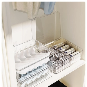 Stackable clear drawer organizers for underwear and socks in a bedroom wardrobe