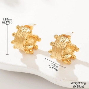 Detailed view of textured gold hoop earrings with dimensions 1.95cm by 1.3cm