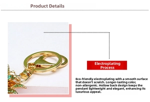 Detail view of gold-plated duck keychain with green rhinestones and hollow back design