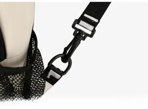 Macro detail of high-quality rotating plastic hook and durable strap on fabric chest bag