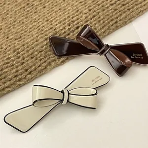 French style 3D bow hair clips in coffee and beige with polished lacquer finish