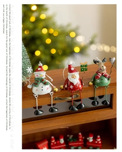 Detailed view of metal Christmas hanging ornaments featuring Santa, snowman and reindeer