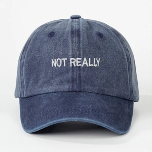 Washed navy blue denim baseball cap with white NOT REALLY embroidery on front