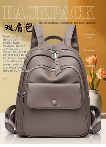 Taupe pebbled leather backpack detail showing multi-layer zippers and soft handle