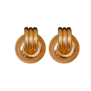 Golden round hollow earrings with retro twisted rope texture and polished metal finish
