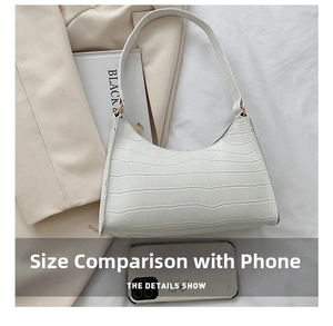 Top view of white faux leather hobo bag with crocodile texture and zipper detail