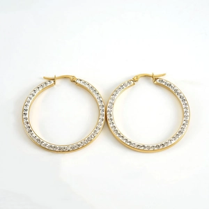 Close-up of 18k gold plated stainless steel hoop earrings with micro-pave white zircon stones