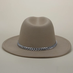 Detail of light tan wool fedora featuring a shiny silver Cuban link chain band