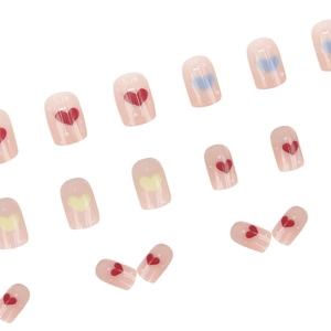 Rainbow heart graffiti press-on nails set with blush pink base and colorful patterns