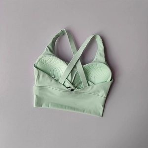 Détail des bretelles croisées et du rembourrage respirant en couleur vert menthe