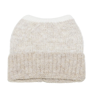 Detail of two-tone knit cat ear hat showing soft beige and white mohair-like texture