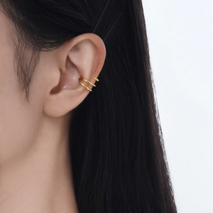 Minimalist double layer gold ear cuff clip in S925 silver worn on model outer ear bone