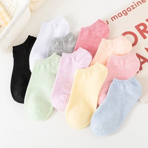 Macro view of colorful cotton ankle socks in pastel candy colors with ribbed elastic cuffs