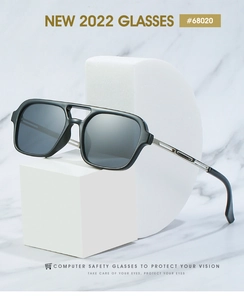 Detail of square pilot computer glasses with double bridge and silver metal temples