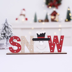 Festive wooden SNOW letter sign with snowman design for Christmas tabletop decor