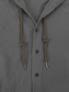 Detail of grey linen hoodie shirt with buttoned henley neck and brown drawstrings