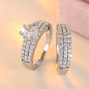 Close-up of sparkling cubic zirconia bridal set with six-prong main ring and stacking band