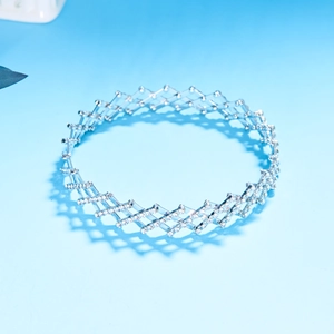 Close-up of telescopic silver ring with seven rows of rhinestones folding into a bracelet