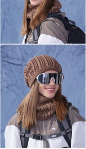 Close-up of thick cable knit winter hat and neck warmer set with warm fleece lining