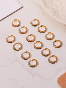 Macro shot of 18k gold plated hoop earrings with multi-colored cubic zirconia inlay