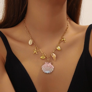 Golden ocean series necklace featuring pink gradient scallop shell and starfish charms