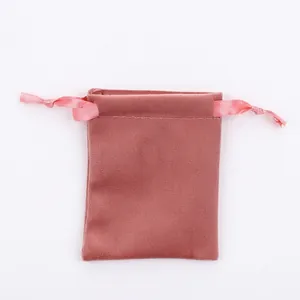 Detailed view of pink velvet drawstring pouch with smooth ribbon for jewelry storage