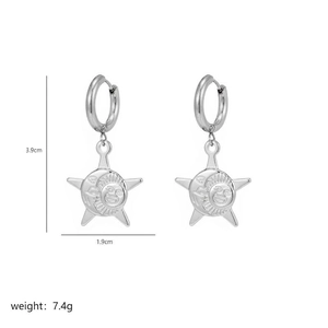 Detailed view of bohemian celestial earrings featuring sun and moon engraved charms
